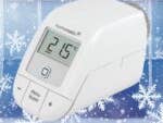 Homematic IP-Thermostat zeigt 21,5°C auf einem verschneiten Hintergrund.