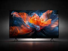 Ein TCL Smart-TV, der ein lebhaftes, farbenfrohes Blumendesign vor dunktem Hintergrund zeigt.