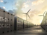 Batteriespeicher, Windräder, Sinnbild für Energieziele