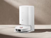 Ein Xiaomi X10 Plus Saugroboter auf einer beigen Oberfläche.