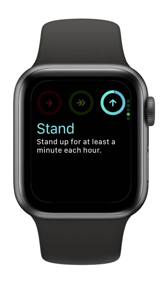Apple Watch SE 3 zeigt die Nachricht 'Stehen: Stehen Sie mindestens eine Minute pro Stunde auf.' an.