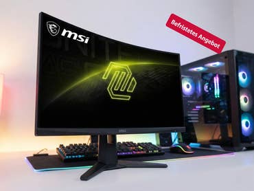 Ein Curved-Monitor von MSI steht auf einem Schreibtisch. Ein 