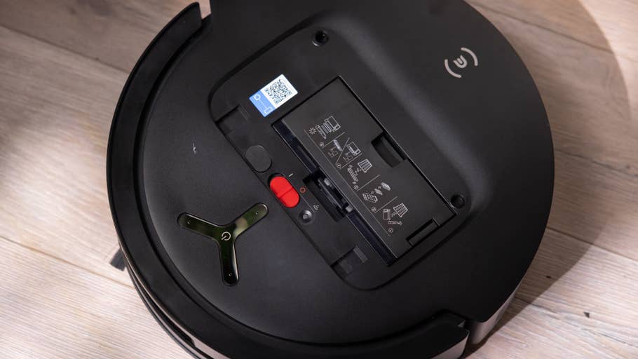 Obenansicht eines Ecovacs T80 Omni-Roboterstaubsaugers mit Batteriefach und Steuerknöpfen.