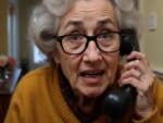An AI-created granny talking on an old-fashioned phone